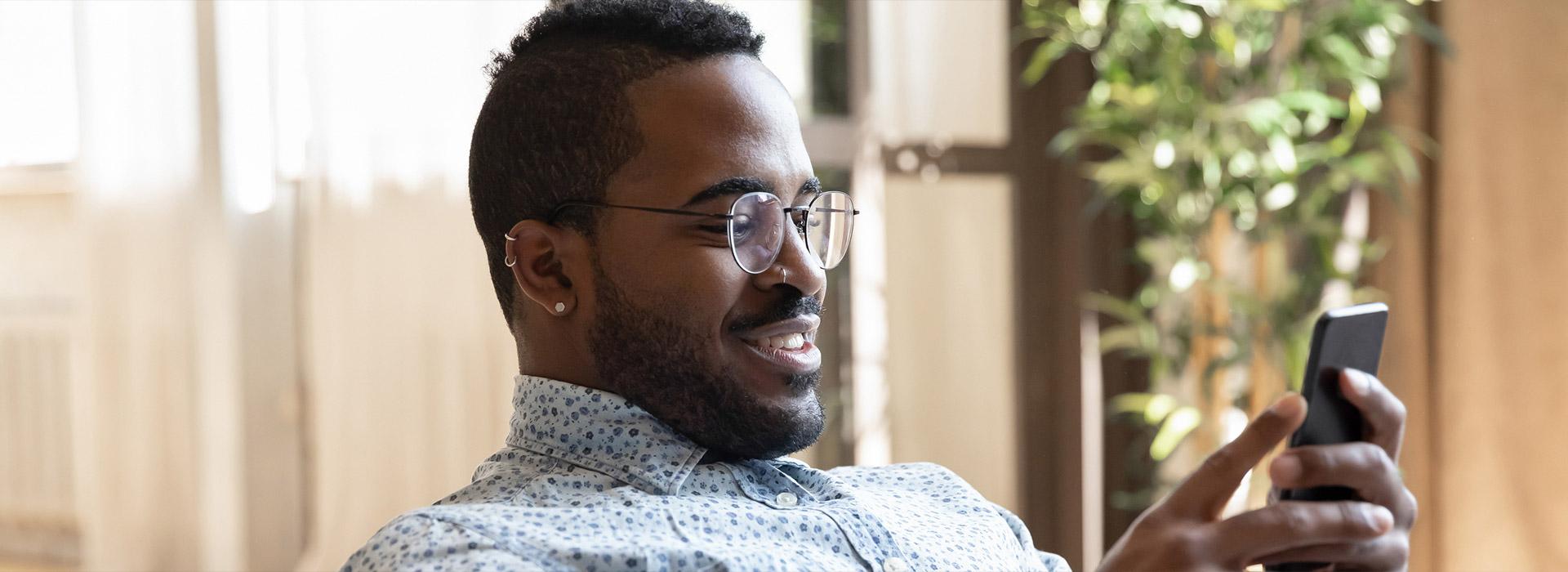 Man holding cell phone in hand