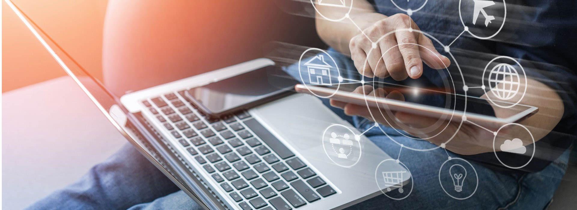 guy holing laptop, tablet and cellphone