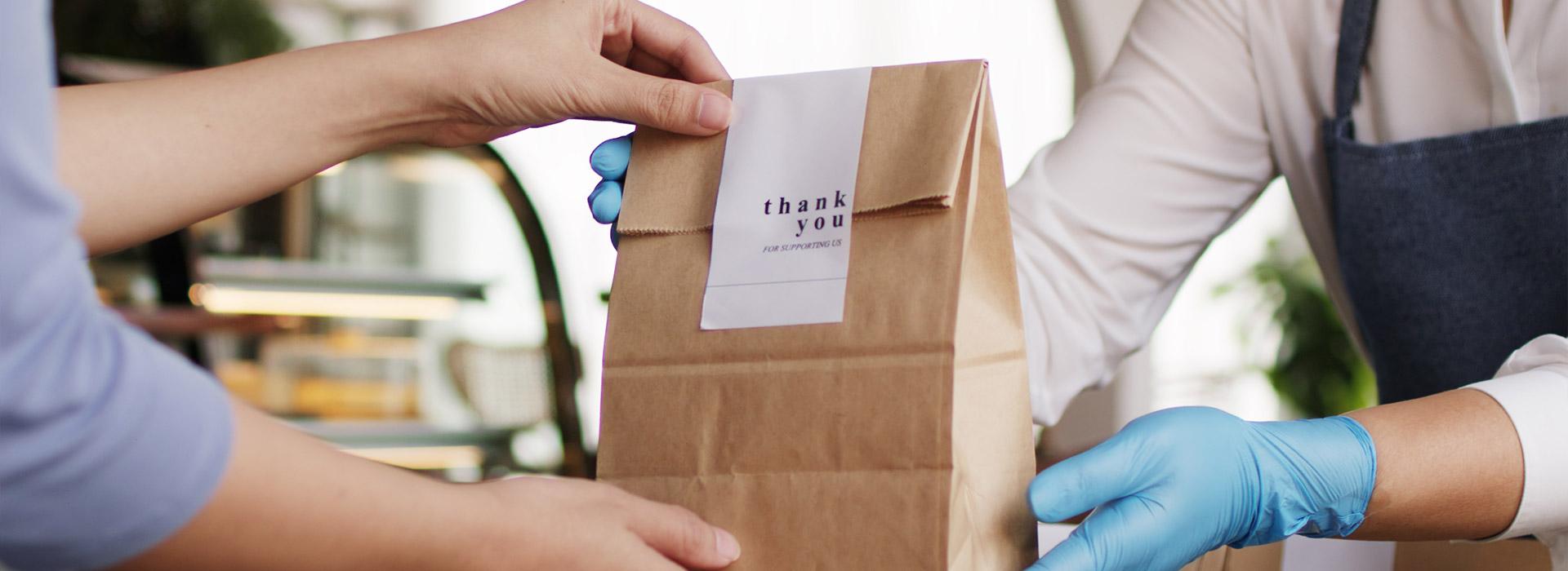 Exchanging bag with "Thank You" on receipt