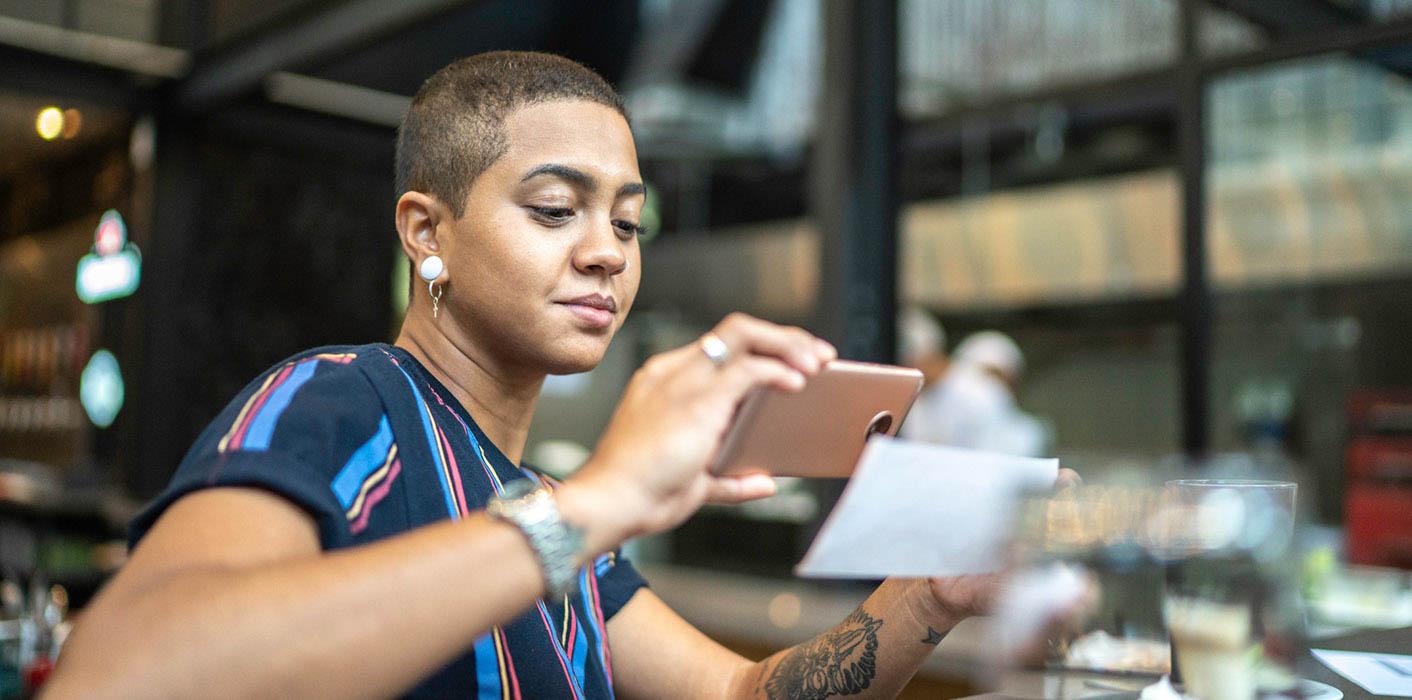woman looking at her cell phone